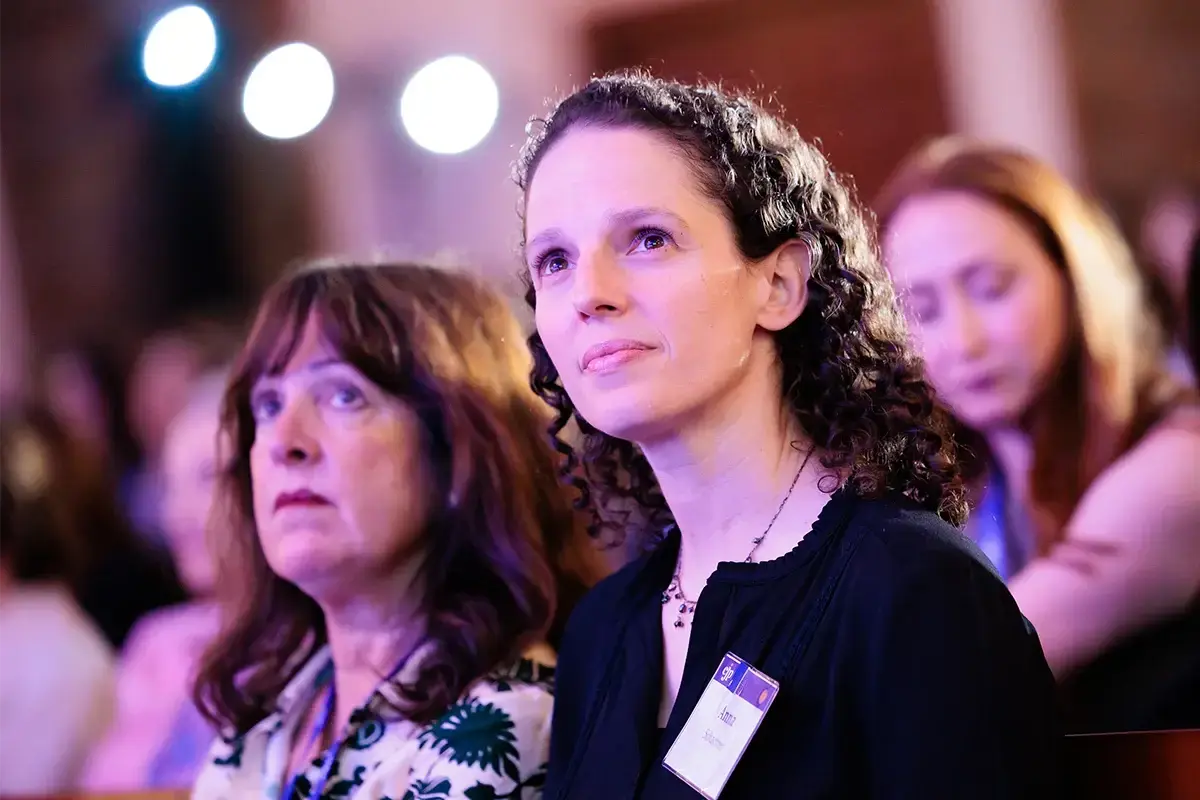 Jewish womens philanthropy: Women listen attentively during a leadership and philanthropy event focused on community engagement and impact.