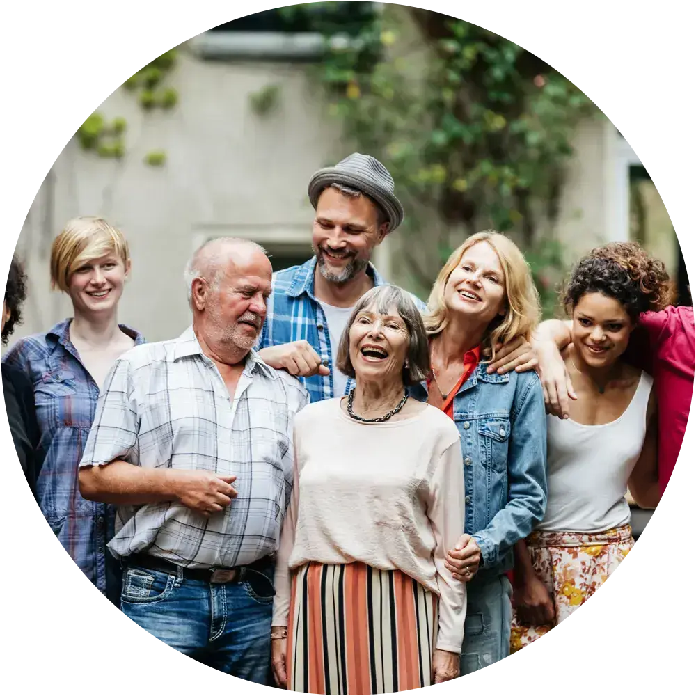 Interfaith family of multiple generations spending time together outdoors.